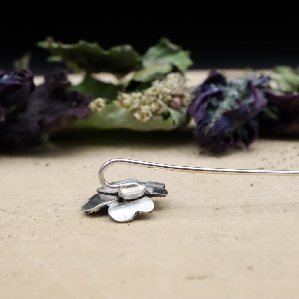 The back of the 4 leaf clover showing how it sits in your ear.