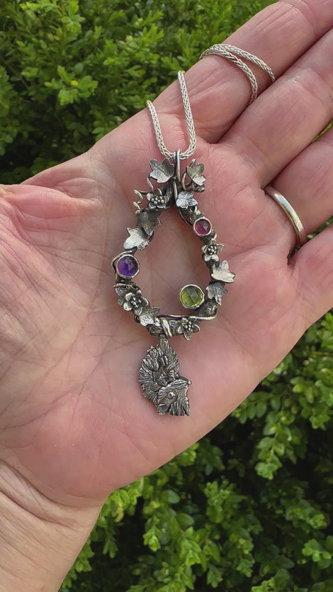 A video showing the possum necklace outdoors.