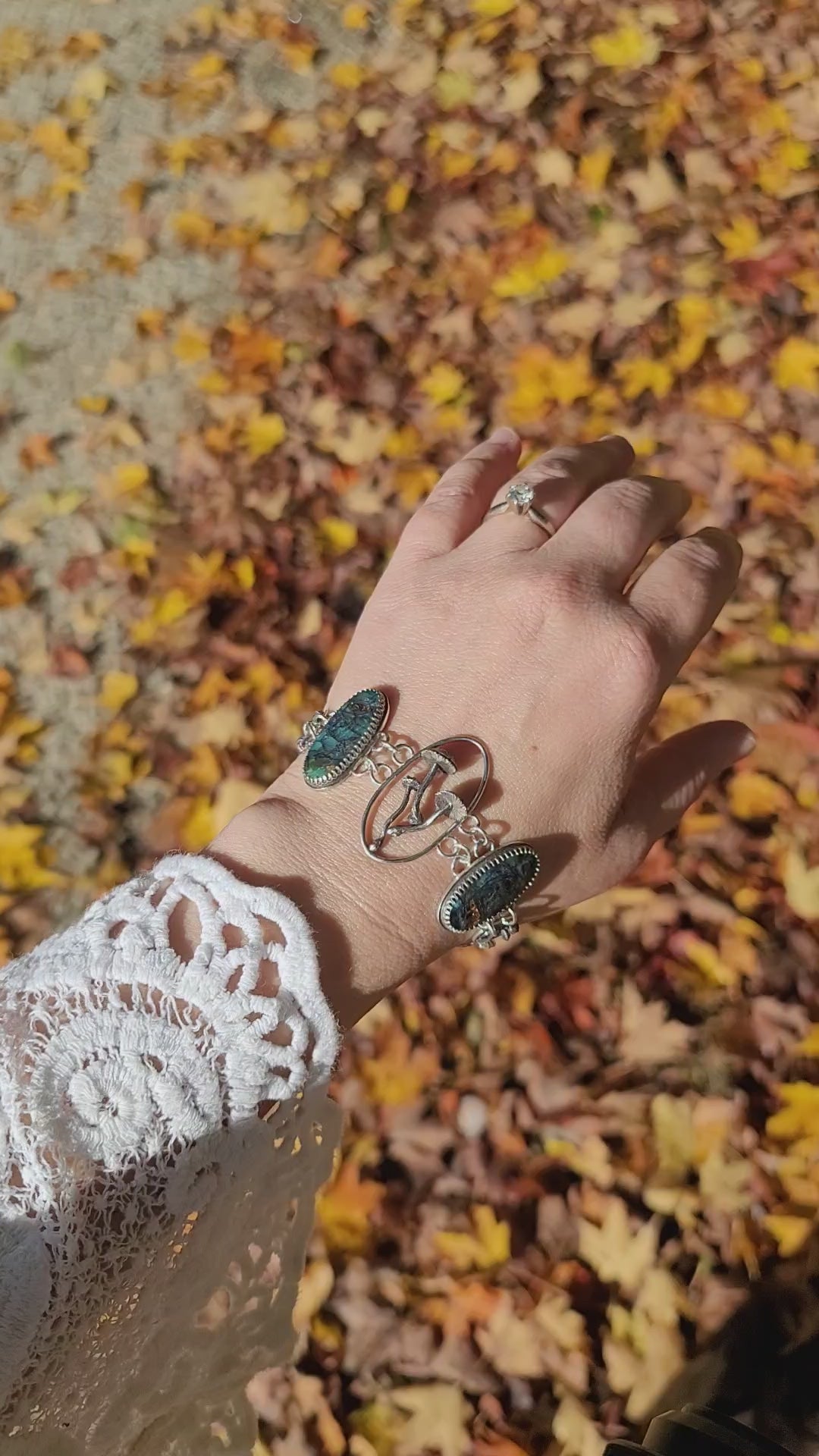 A video showing someone wearing the fairy ring mushroom bracelet made from sterling silver and one of a kind.