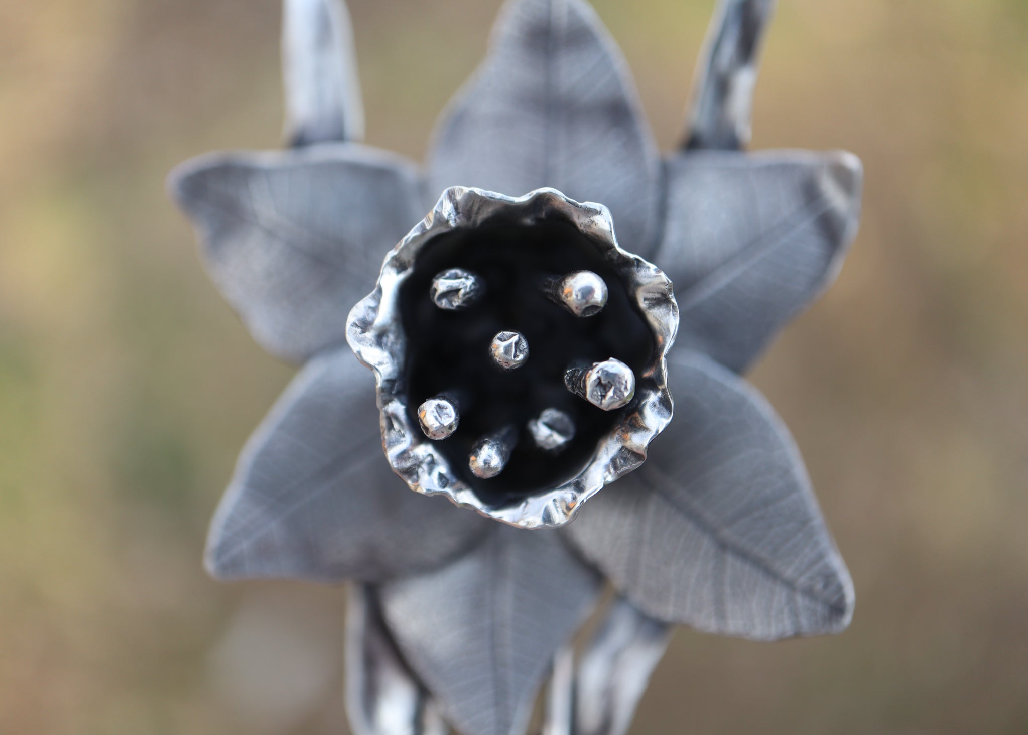 The center of the sterling silver daffodil has stamens to represent real flowers.