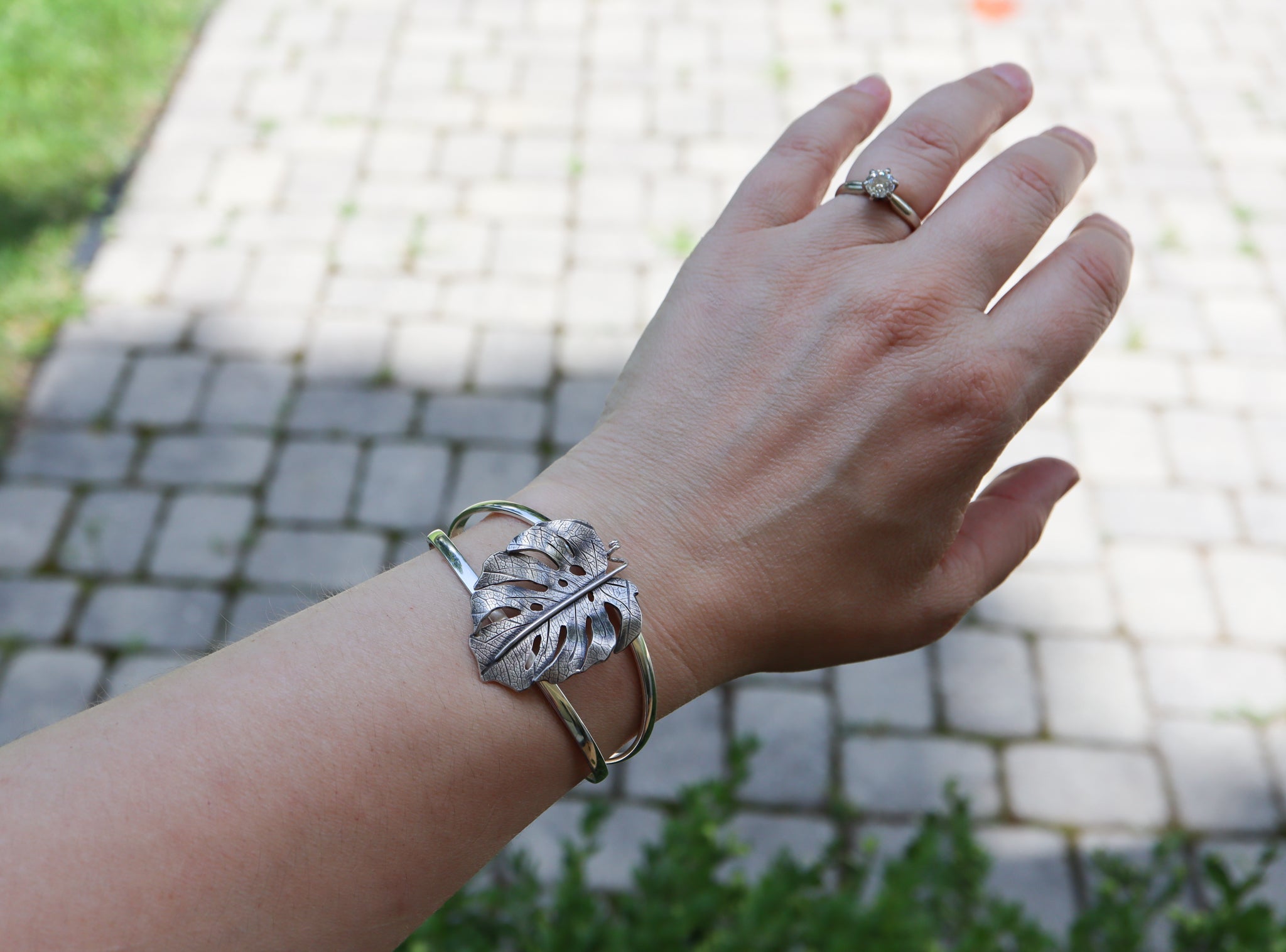 The bracelet is shown being worn.