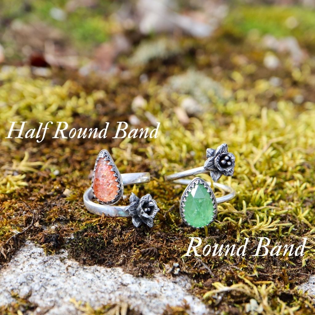 A photo showing the two different ring band choices. One is a round shank style and the other is a flattened half round style.