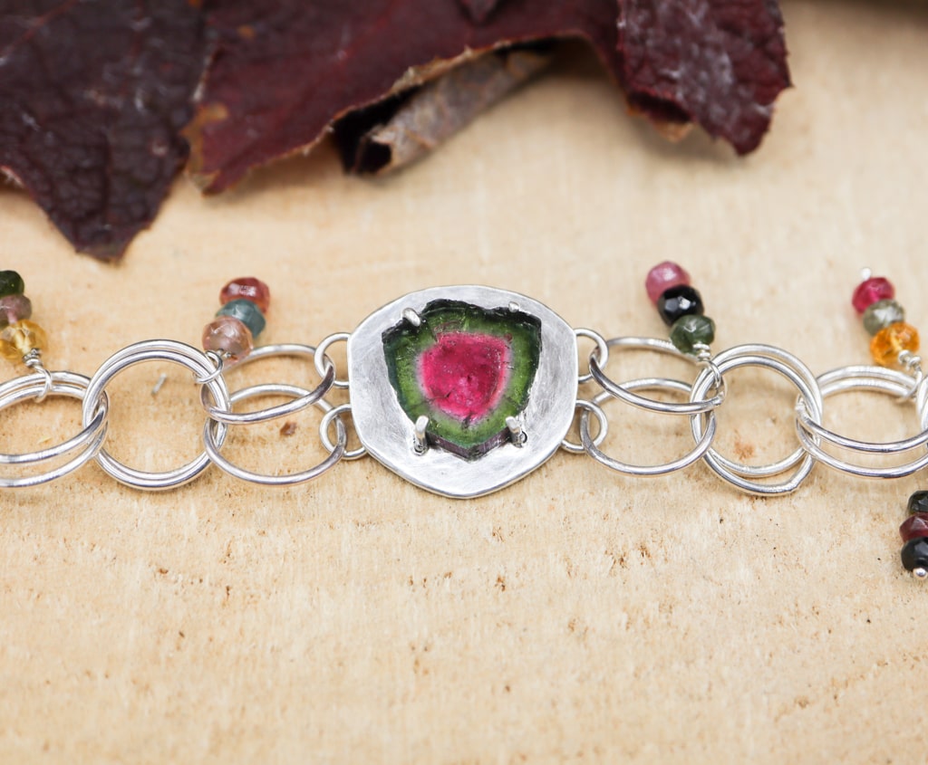 A close up of the central watermelon tourmaline slice stone.