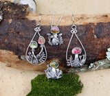 A set of earrings, ring, and necklace that all match the watermelon tourmaline gemstone mushroom theme. 