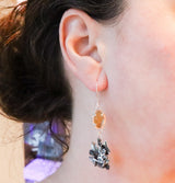 The sterling silver handmade spring peeper frog earrings are shown being worn. They are about 3 inches long. 