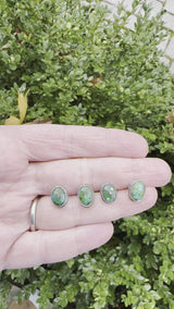 A video showing two pairs of the earrings outdoors. 