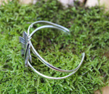 A top view of the bracelet showing the double bands. The bracelet is on a piece of light green moss. 