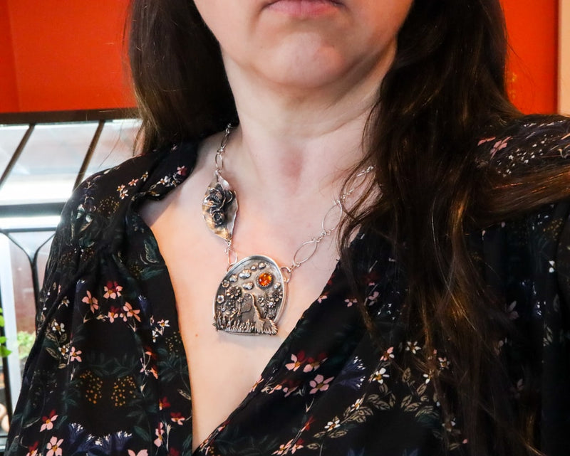 The skunk necklace shown being worn.