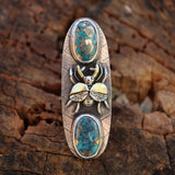 Sterling silver and 24 karat gold stag beetle ring with two morenci turquoise stones with flecks of silver pyrite in them. The background of the ring is pressed with a real leaf and is about 2 inches tall.